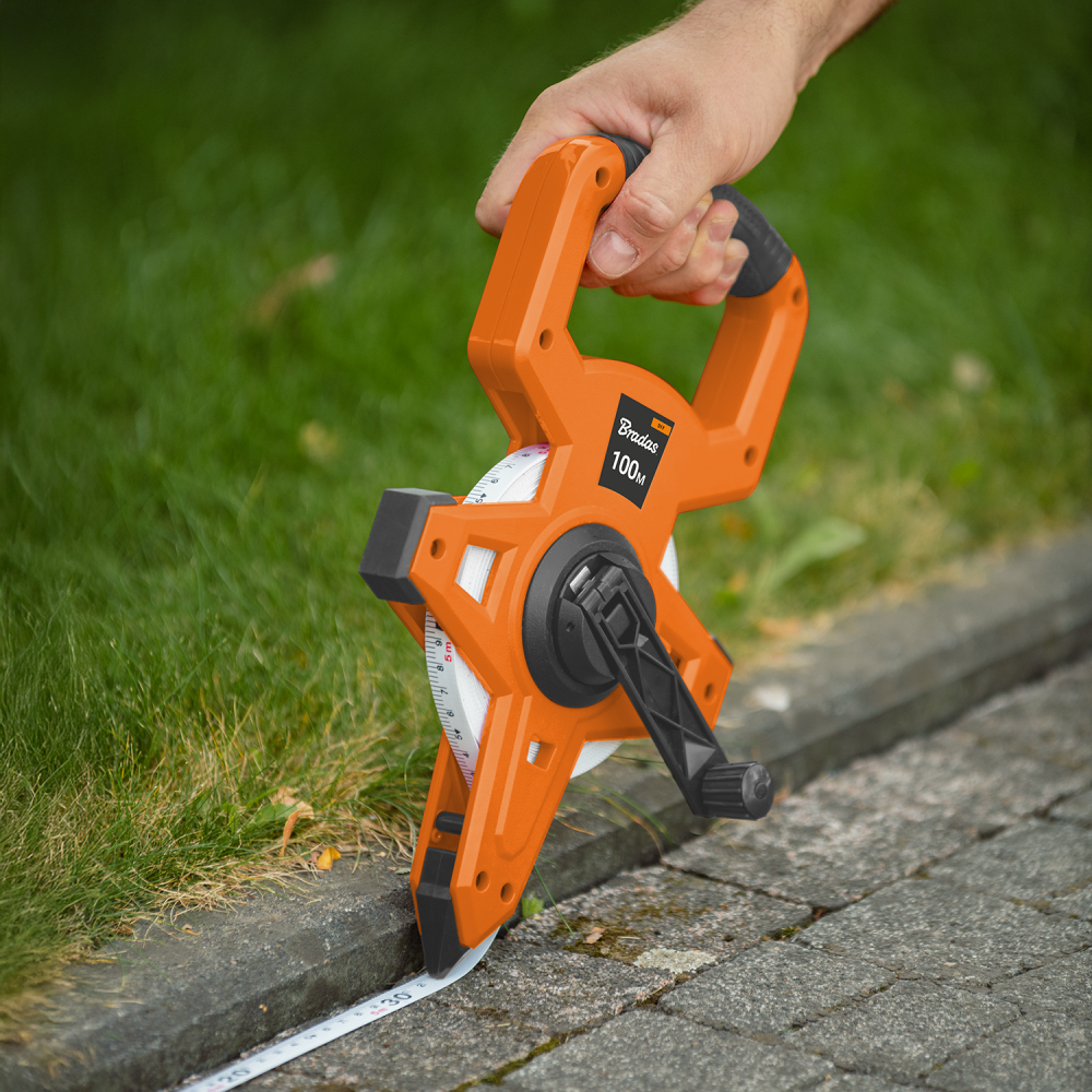 Fibreglass Coiled Tape Measure with Handle, 15mm Wide, Black/Orange (30m-100m)