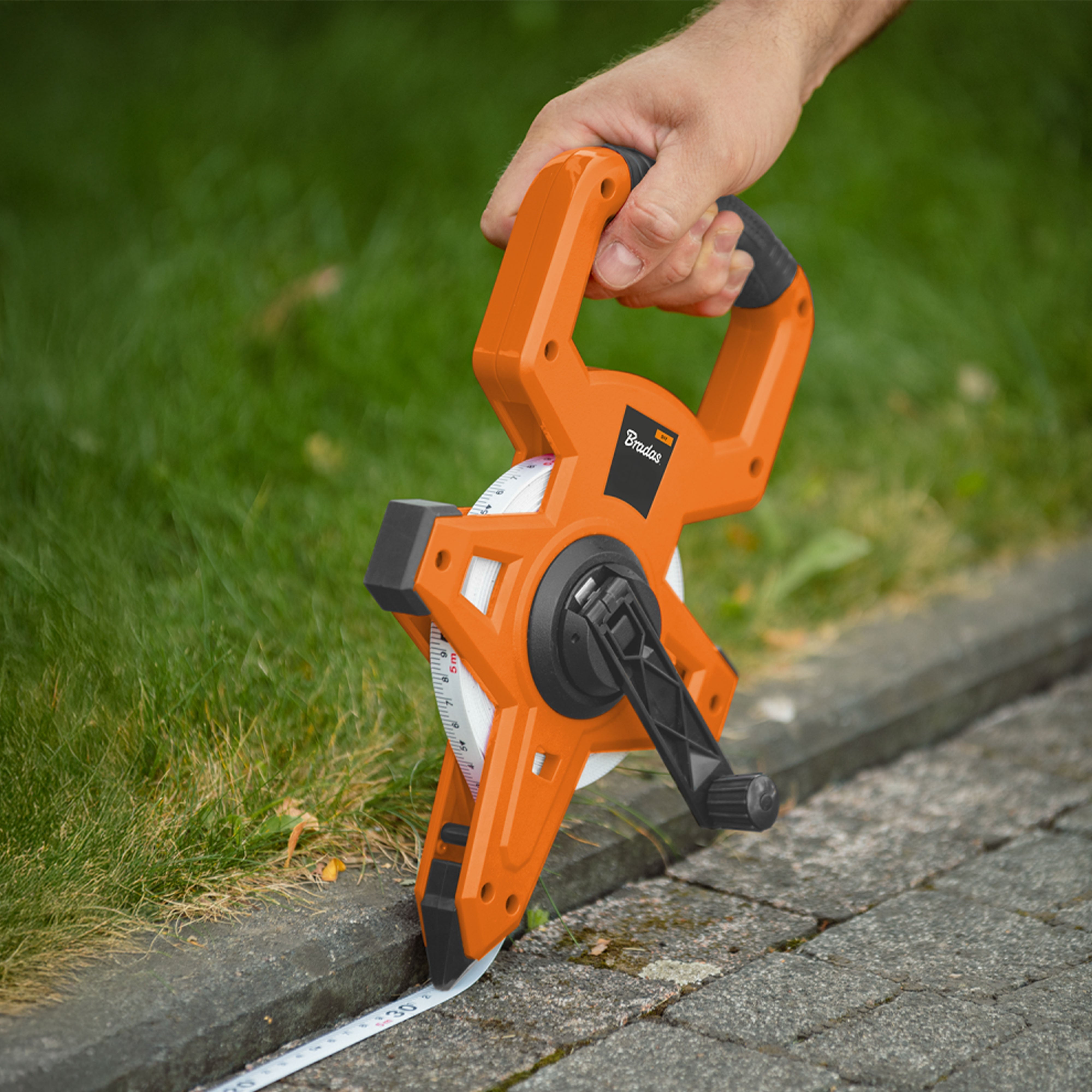 Fibreglass Coiled Tape Measure with Handle, 15mm Wide, Black/Orange (30m-100m)