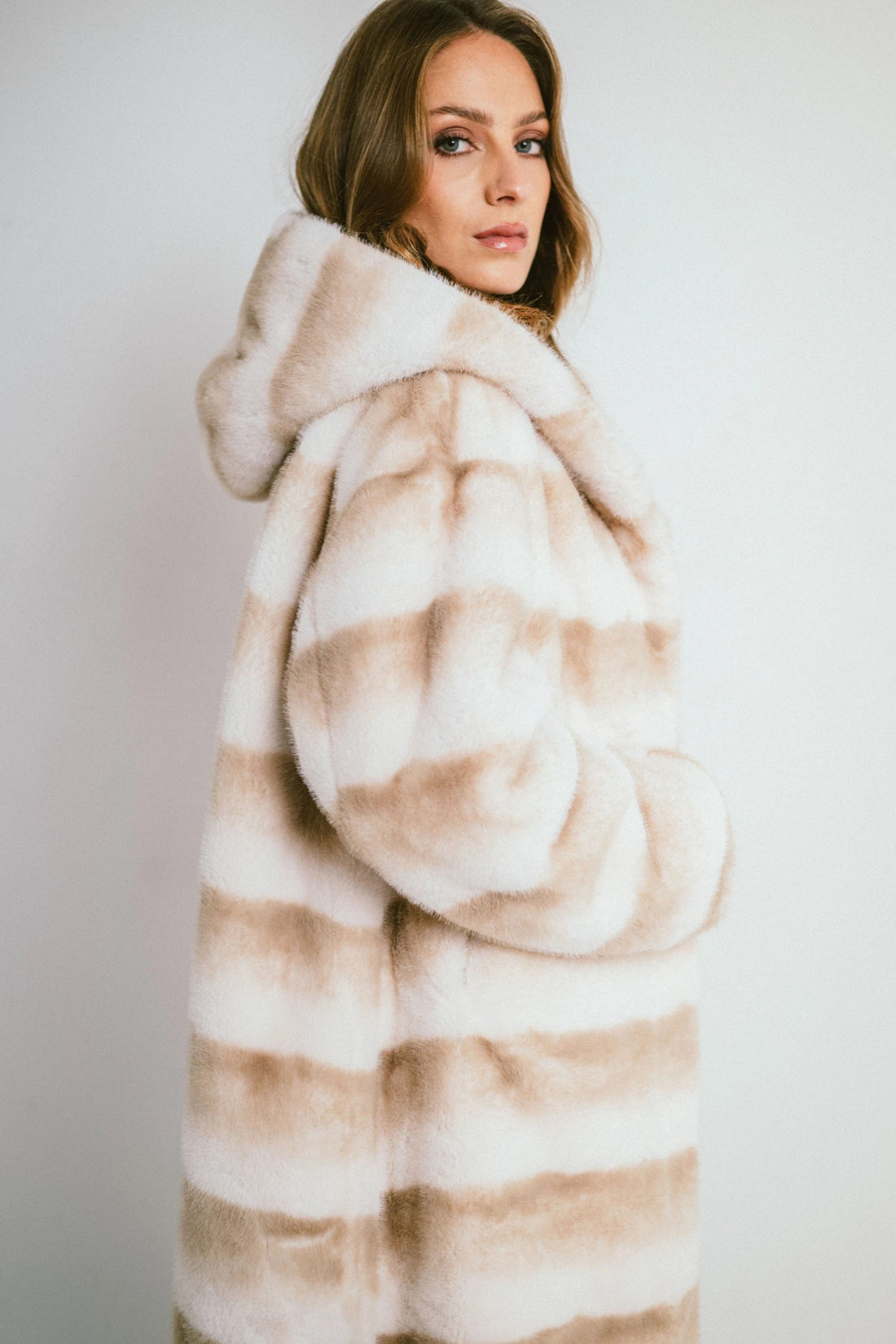 ASTORIA – Long hooded coat in striped faux fur